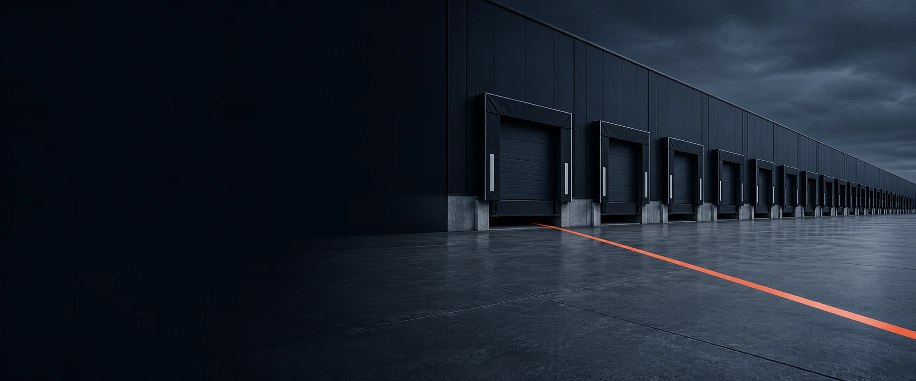 The long facade of a cross-dock at first light with every door shut. A coral line runs from a door threshold across the empty apron.